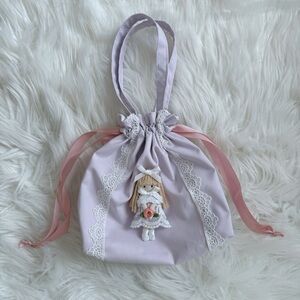 Elegant Lavender Drawstring Bag with Doll Accent